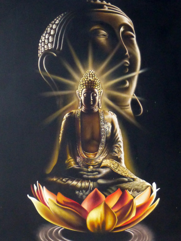 Meditating buddha and lotus flower
